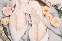 gorgeous white wedding shoes with silk ribbon straps and large pearls for a touch of glam and chic