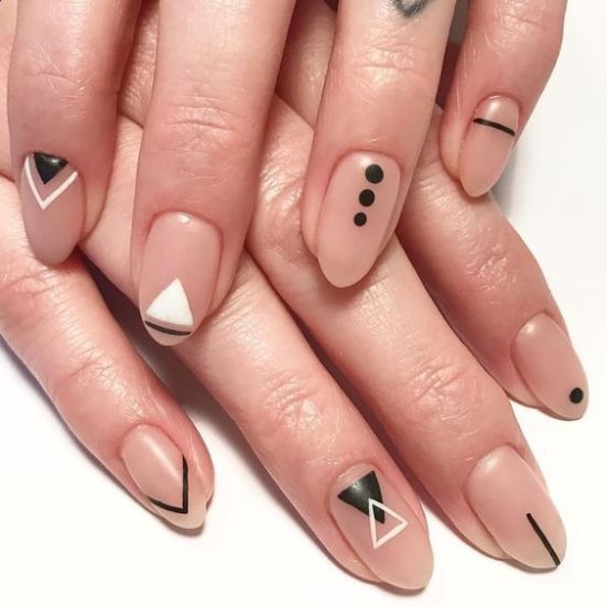 matte nude nails with white and black tribal patterns look magnificent and very bold, ideal for a boho wedding