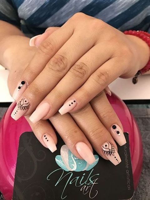 nude and black nails with patterns and beads are amazing for a boho bride
