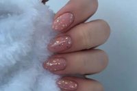 very pretty pink nails with touches of holographic foil will be a nice solution for a bride who loves to party