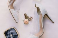 white glitter and sheer acrylic wedding shoes are a trendy solution for a fashion-forward bride