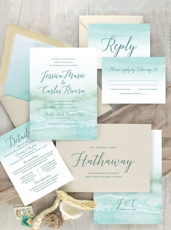 a beach wedding invitation suite done with tan, light green and aqua colors, with watercolors and calligraphy is a very cool and chic idea