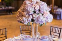 a beautiful lilac and blush wedding centerpiece of blooms looks refined and very chic