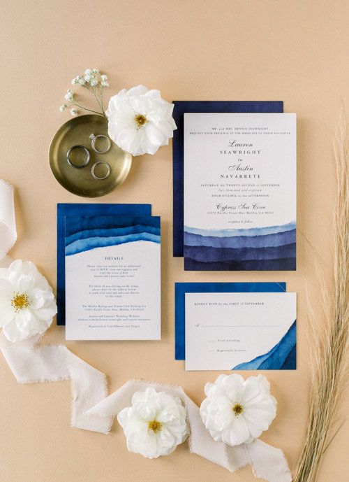 a bold and catchy wedding invitation suite with navy and blue stripes that remind of the sea waves and black and navy calligraphy