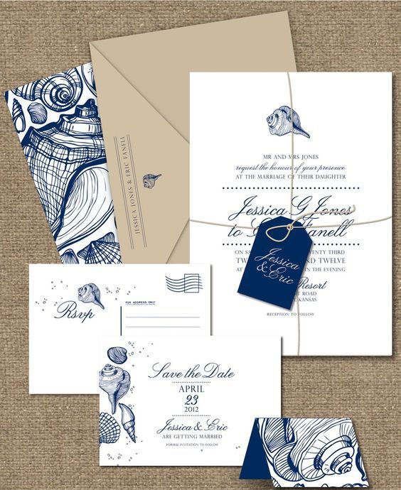 a bright nautical or beach wedding invitaiton suite with a tan envelope, navy and white invites and RSVP and sea-inspired prints