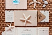 a delicate and pretty wedding invitation suite with tan and neutral envelopes and invites, with calligraphy and star fish prints is amazing