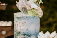 a mind-blowing water color beach wedding cake