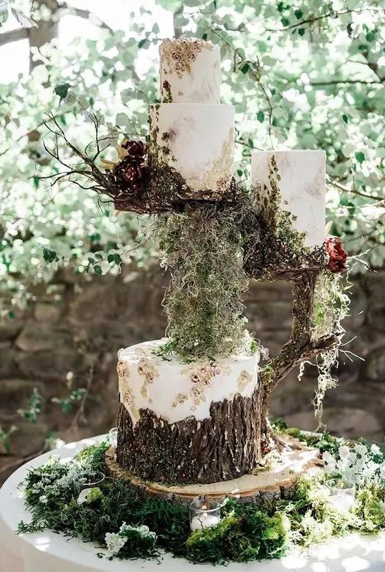 a jaw-dropping assortment of enchanted forest wedding cakes covered with buttercream, with bark and blooms, with moss and branches