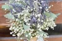 a lavender and baby’s breath wedding bouquet with foliage is a chic rustic idea
