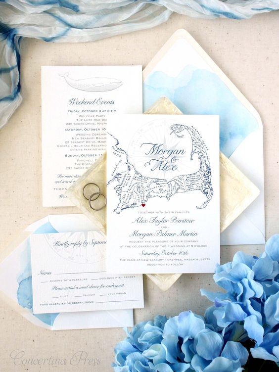 a lovely and pretty beach wedding invitation suite with light blue watercolors, with a painted map and some navy calligraphy is amazing