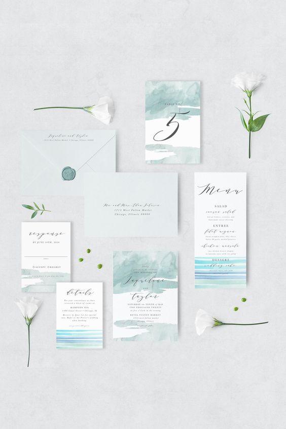 a lovely wedding invitation suite with light grey envelopes, invites with light green, blue and turquoise stripes is wow