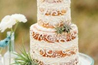 a naked patterned beach wedding cake with pearls and air plants is a lovely and chic dessert for a beach or coastal wedding