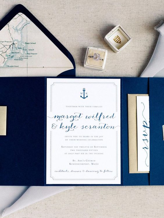 a nautical and beach navy wedding invitation suite with painted maps, calligraphy and navy envelopes is a lovely and stylish idea