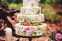 a quirky five tier floral wedding cake that shows off beautiful painting and some sugar blooms is amazing and adorable