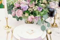 a textural lilac napkin and a lilac and blush wedding centerpiece with some foliage for a beautiful garden wedding