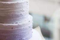 a textural ombre lilac wedding cake of three tiers is a chic and stylish idea to go for