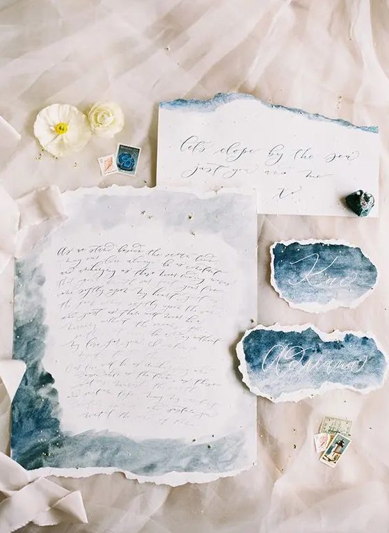 airy blue and grey watercolor wedding stationery with a raw edge for a beach or coastal wedding