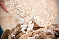 chic woven fans will help your guests avoid overheating and will add a nice tropical touch to their looks