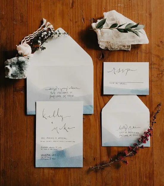 coastal watercolor blue wedding invitations with black letters look minimal and stylish