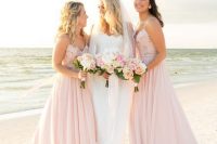 glam light pink A-line bridesmaid dresses with embellished bodices and spaghetti straps are romantic and bright