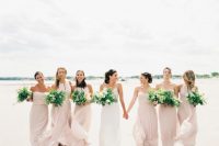 mismatching blush maxi bridesmaid dresses are a lovely and girlish solution for a modern romantic beach wedding