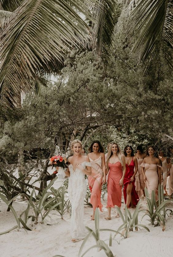 mismatching pink, red, blush and ombre maxi and midi bridesmaid dresses show off the style of each gal