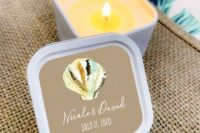 personalized beach candles in jars with lids, a gold seashell are a wonderful beach wedding idea