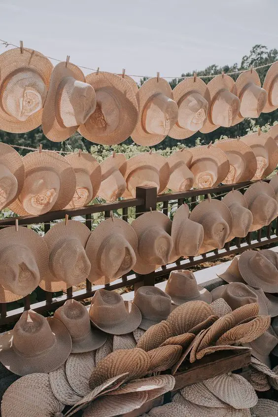straw hats and straw fans are lovely wedding favors for beach and tropical weddings, this is much care