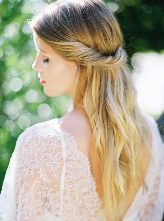 a casual twisted half updo is a timeless solution for any romantic bride, it can be worn at a beach or some other wedding