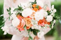 a cool summer wedding bouquet of white, pink and orange blooms and some greenery is amazing for summer