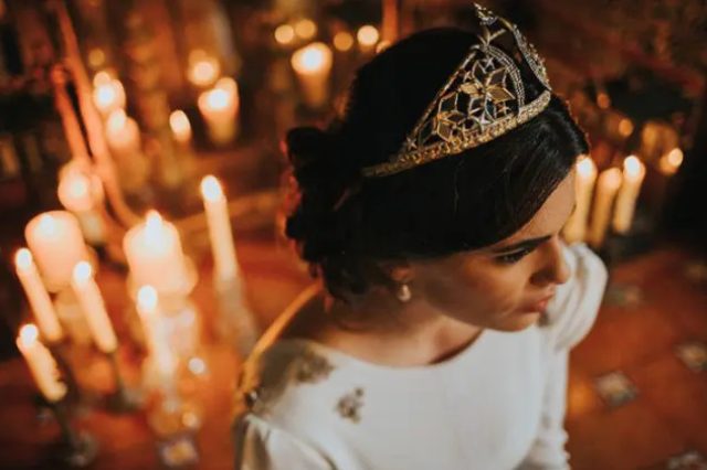 a gorgeous gold and rhinestone wedding tiara will give your look a royal feel at the wedding