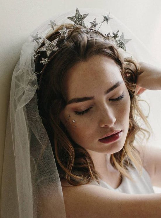 a gorgeous silver rhinestone star headpiece paired with a veil is a perfect idea for a celestial bride