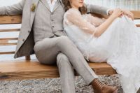 a grey three-piece suit, a white shirt, a brown cap and brown shoes for a vintage-inspired groom’s look