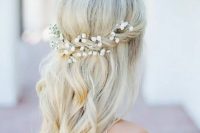 a half up with a twist and baby’s breath in it, some waves for a romantic look at a boho beach wedding or some other boho wedding
