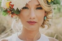 a large summer floral crown with neutral, pink, yellow and orange blooms plus greenery is a gorgeous idea for a spring or summer bride