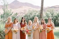 a mismatching bridal party look with blush, light pink, beige and orange maxi dresses for a summer or fall wedding