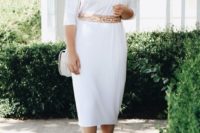 a simple and stylish white plain midi dress with a high neckline, short sleeves, an embellished waistline and blush shoes
