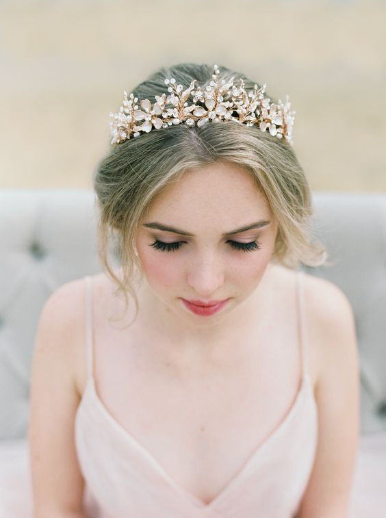 a statement floral tiara in gold, with rhinestones is a perfect solution for a romantic bridal look, perhaps with a pink wedding dress