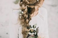 a very dimensional and textural braid made of two side ones with fresh flowers is always a good idea for a relaxed or boho bridal look