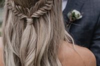 a wavy half updo with braids and a tiny embellished hairpiece is a very dreamy and chic idea