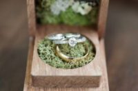 a wooden box filled with moss is a chic idea for a woodland wedding