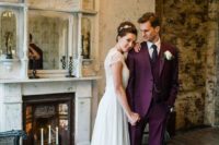 an elegant vintage-inspired groom’s outfit with a burgundy three-piece suit, a black tie and shoes plus an off-white button down