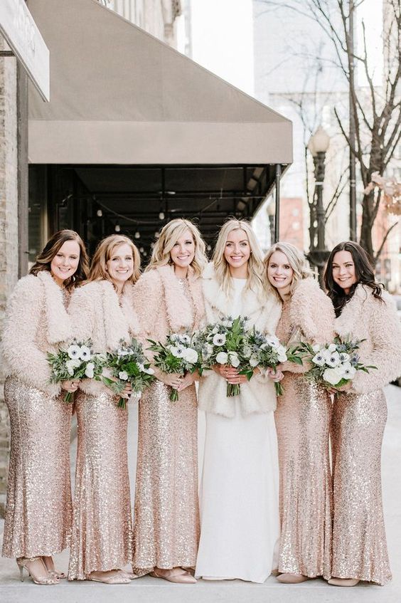 beautiful blush sequin maxi bridesmaid dresses with blush jackets and metallic shoes for a glam winter wedding