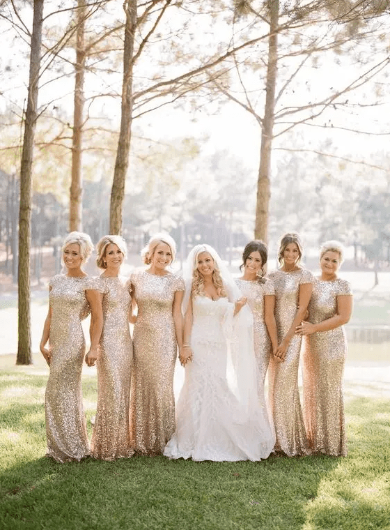 blush sequin sheath bridesmaids’ dresses with cap sleeves are a very glam idea