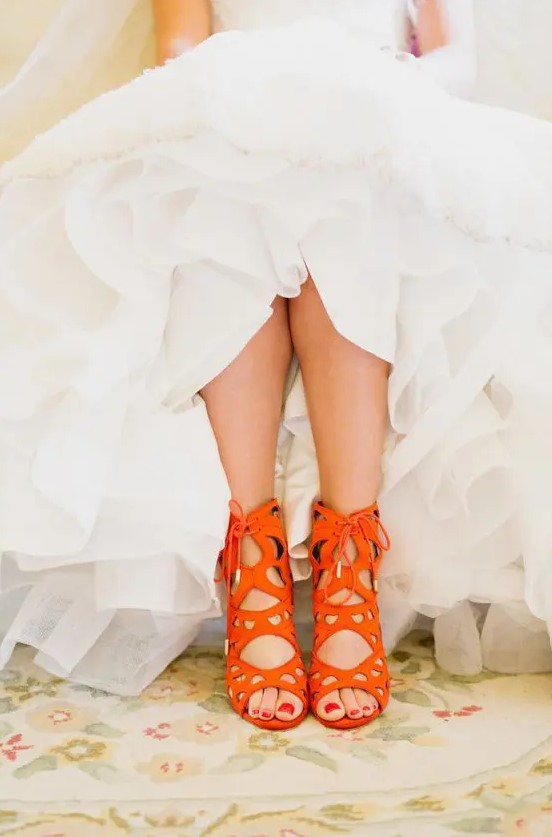 bold orange laser cut wedding shoes with lacing up will make a fantastic color accent in the bridal look
