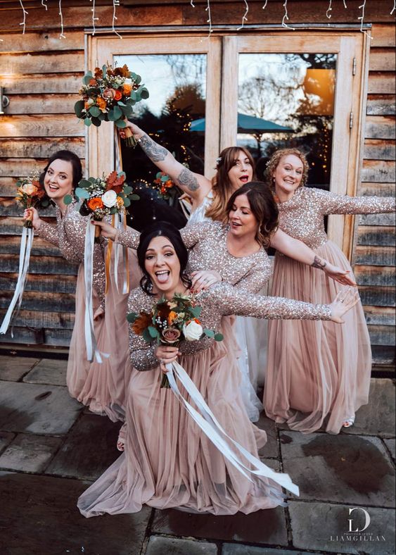 cool rose gold maxi bridesmaid dresses with sequin boidces and layered tulle skirts for a fall wedding