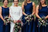 elegant navy A-line bridesmaid dresses with high necklines, no sleeves and pleated skirts are amazing for a retro wedding
