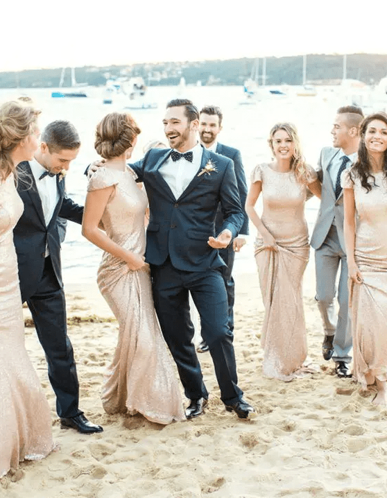 glam bridesmaids wearing gold sequin maxi dresses with cap sleeves look amazing