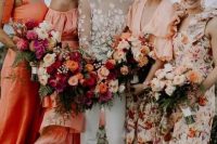 gorgeous mismatching bridesmaid dresses – solid orange ones and peachy floral ones are great for a beach wedding with a pop of color