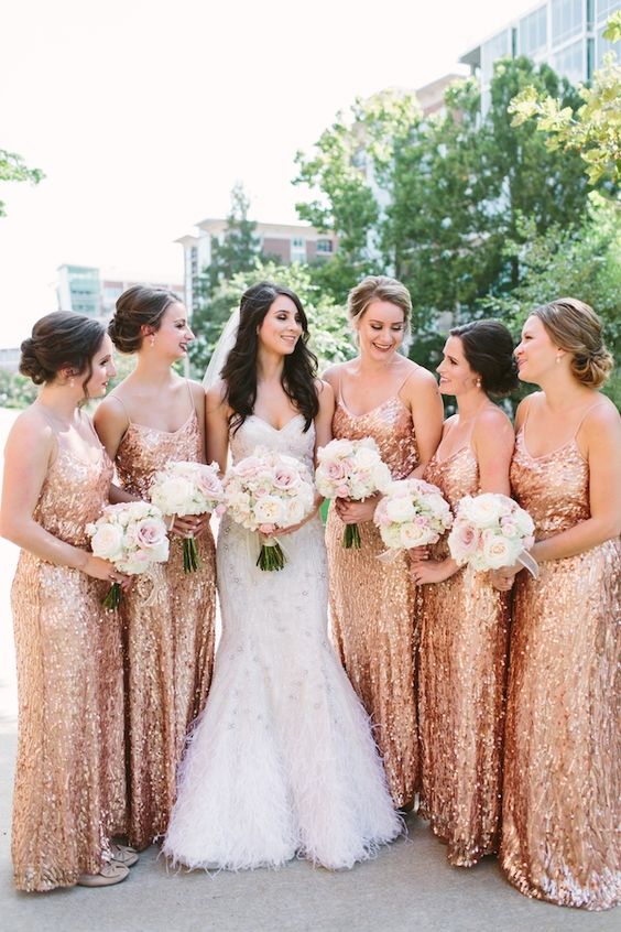 Matching rose gold sequin maxi bridesmaid dresses with spaghetti straps and V necklines